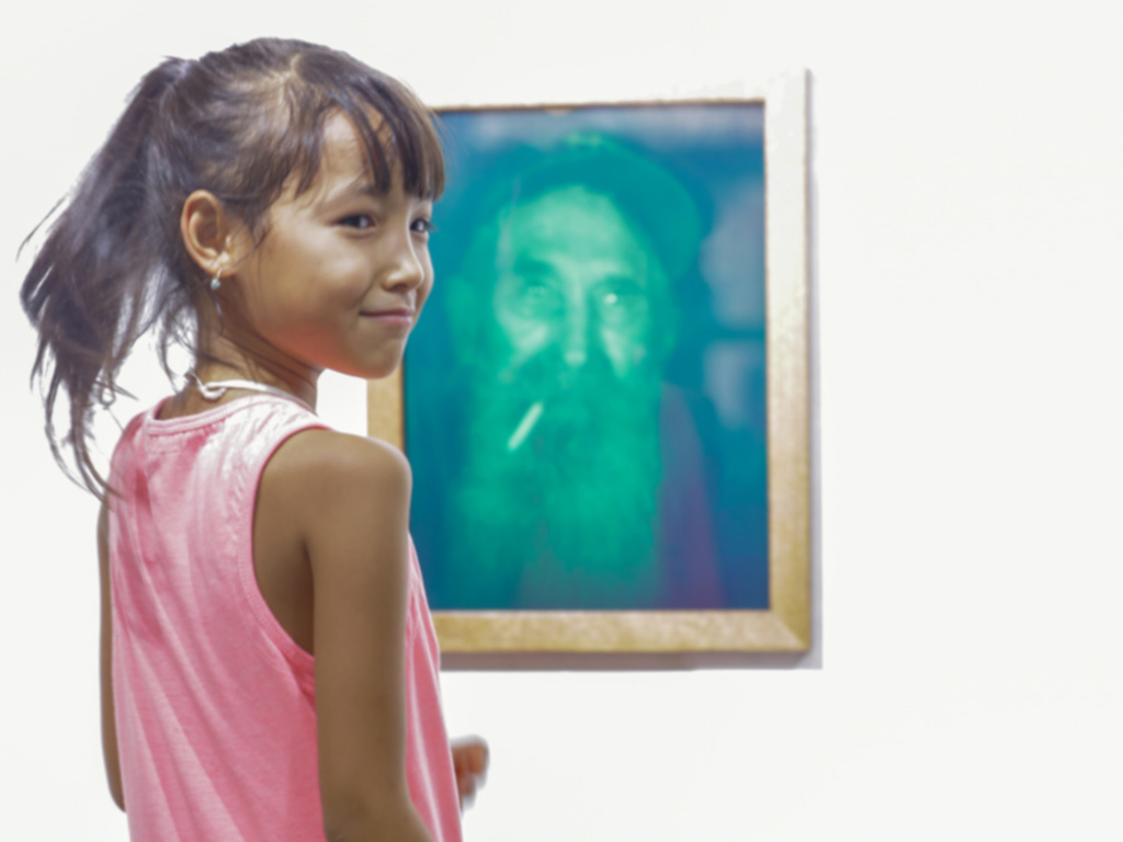 Child and a painting on the wall as background at AlSeef